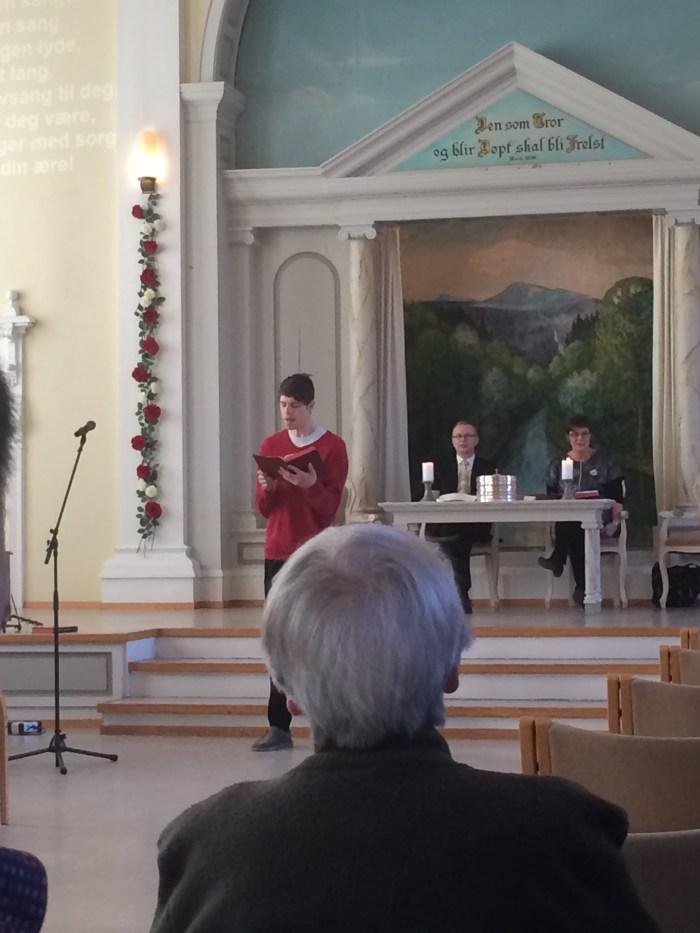 Tim leading the congregation in singing.